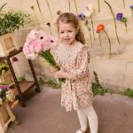 La face avant de la robe Saralou de la marque Louise Misha portée par un enfant